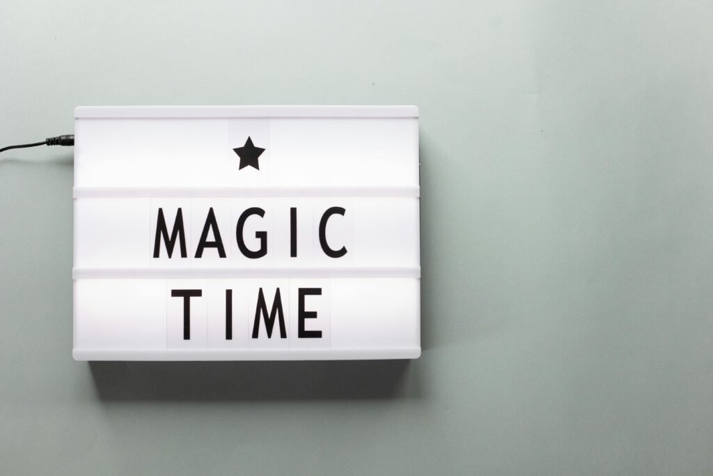 Minimalistic lightbox with 'Magic Time' text on a soft background, creating a modern and festive vibe.